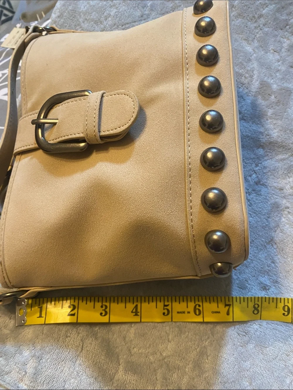 New No Boundaries Stud-Trim Tan Crossbody Bag with Buckle Strap